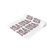 USA themed table runner partially rolled up on a white background.
