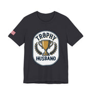 Black t-shirt with 'Trophy Husband' graphic design on a white background