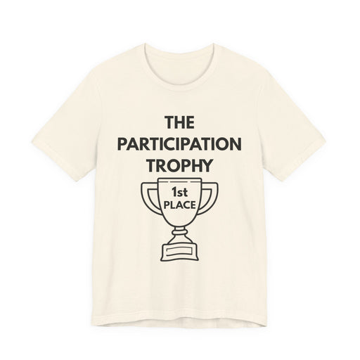 Beige t-shirt with 'The Participation Trophy 1st Place' text and graphic on a white background