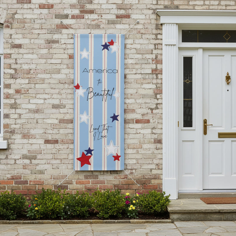 Patriotic matte banner 36x96 with strips and red white and blue stars hanging next to front door.