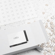 A customizable puzzle that has pieces scattered coming out of a box  on a white background.