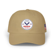 All khaki classic ball cap with a circular emblem featuring an eagle and text , along with the American flag on the side on a white background.