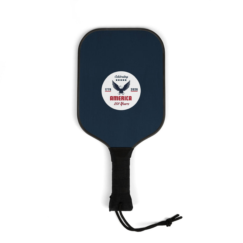 Navy blue pickleball paddle with a white logo that says 'Celebrating America 250 years' on a white background. 