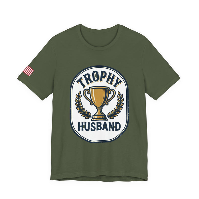 Green t-shirt with 'Trophy Husband' graphic on a white background