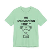 Mint green t-shirt with 'The Participation Trophy 1st Place' text and graphic on a white background