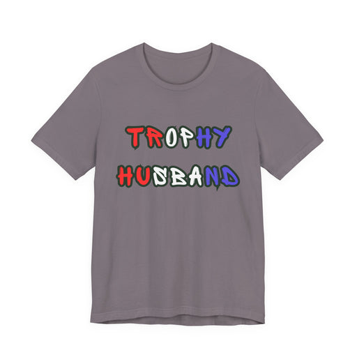 Gray t-shirt with 'Trophy Husband' in red white and blue text on a white background
