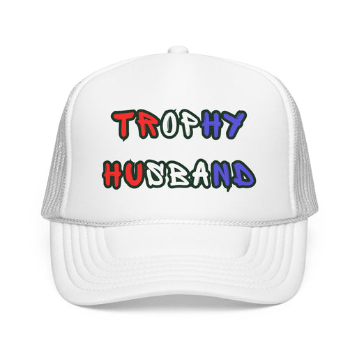 White trucker hat with 'Trophy Husband' in red white and blue text,  against a white background