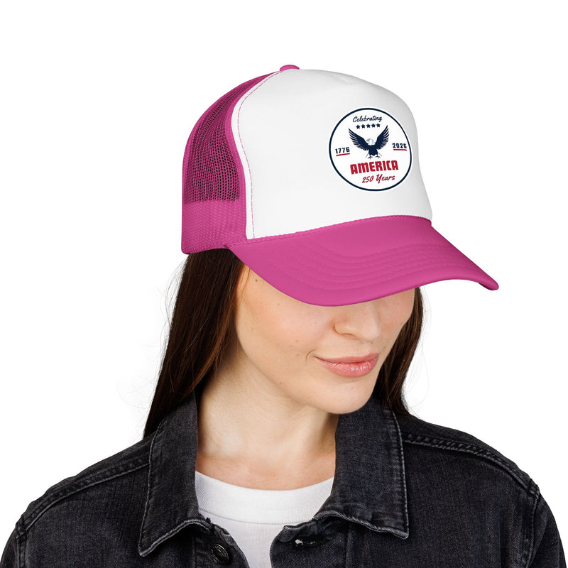 Hot pink trucker hat with 'Celebrating America for 250 Years' design displayed on female on a white background.