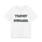 White t-shirt with 'Trophy Husband' text on a white background