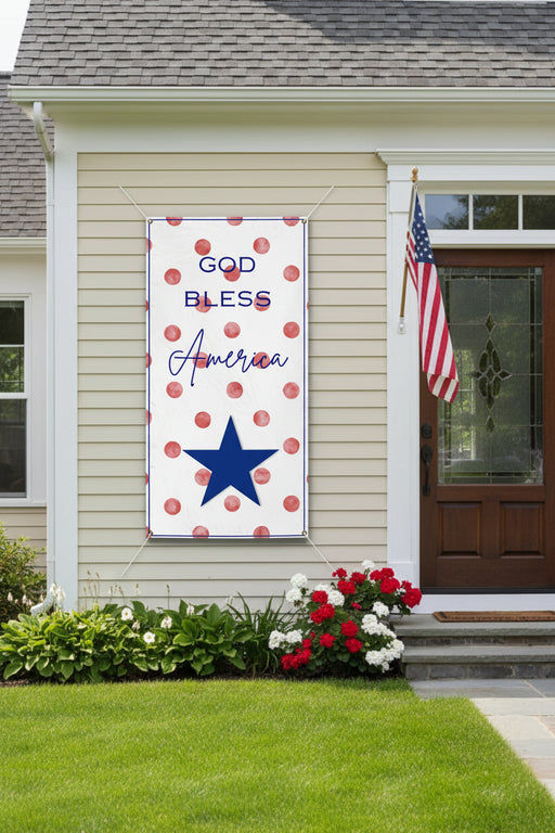 Patriotic “God Bless America” vinyl banner with red polka dot background, 36x72 and 24x48 inches on front of house.
