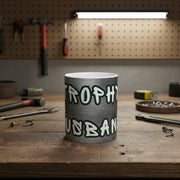 Mug with 'Trophy Husband' text on a garage work bench