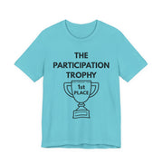 Bright blue t-shirt with 'The Participation Trophy 1st Place' text and graphic on a white background