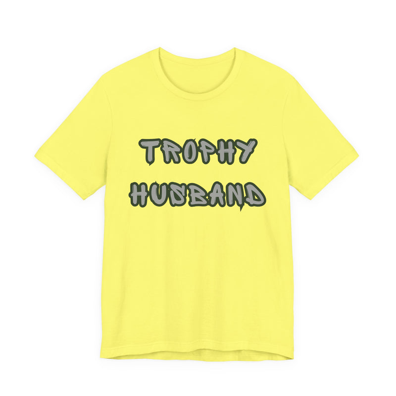 Yellow t-shirt with 'Trophy Husband' text on a white background