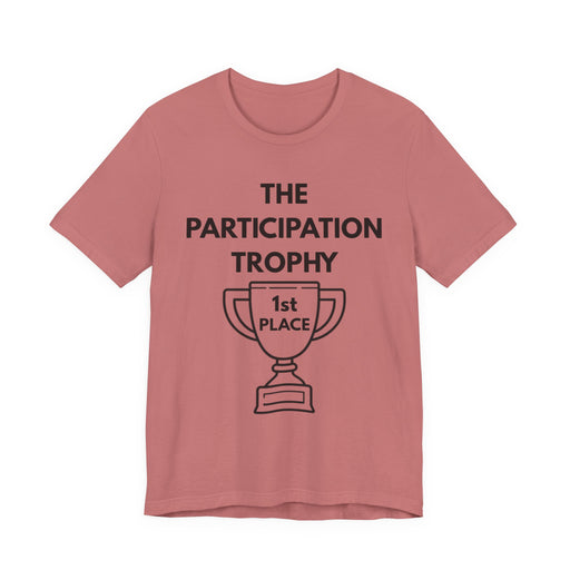 Pink t-shirt with 'The Participation Trophy 1st Place' text and graphic on a white background