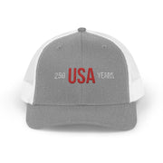 Grey and white trucker cap with 'USA 250 YEARS' text on a white background.