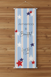 Patriotic matte banner 36x96 with strips and red white and blue stars on wood wall.
