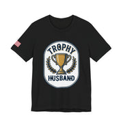 Black t-shirt with 'Trophy Husband' graphic on a white background