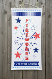 Patriotic vinyl banner with red white and blue stars, fireworks and the word fireworks 24x48 and 36x72 inches on wood fence.
