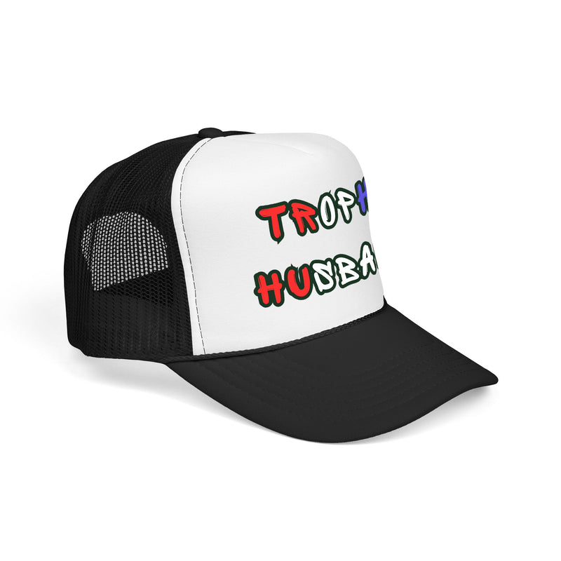 side view of a Black and white trucker hat with 'Trophy Husband' in red white and blue text, against a white background