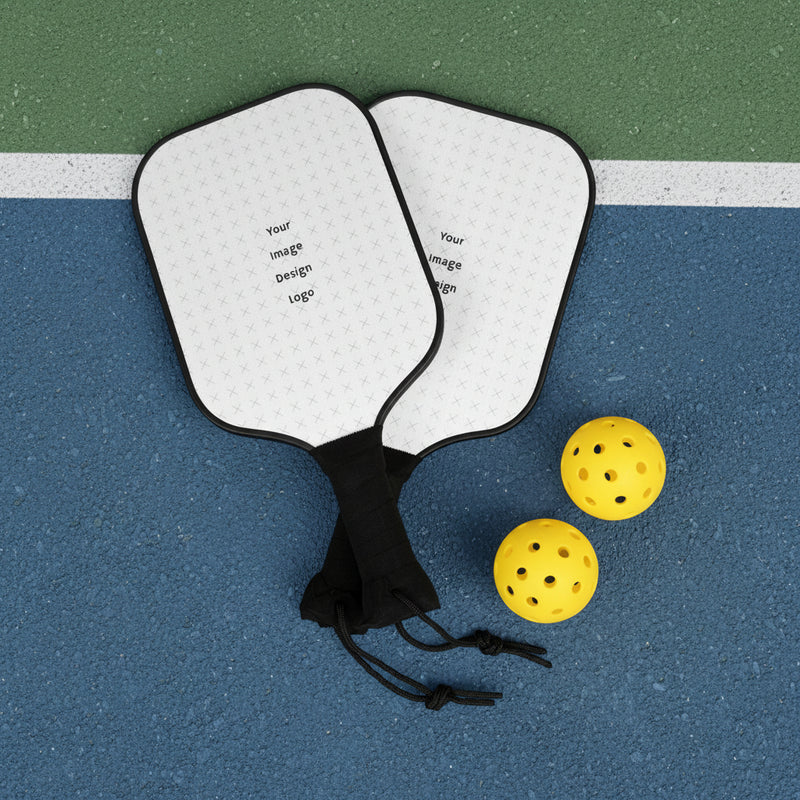 Customizable white pickleball paddle set with black handle displayed on a pickle ball court. 