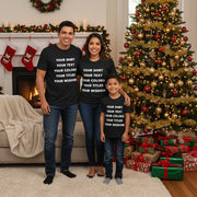 Family wearing matching custom text t-shirts in front of a Christmas tree — personalized group tees on Bella Canvas 3001.