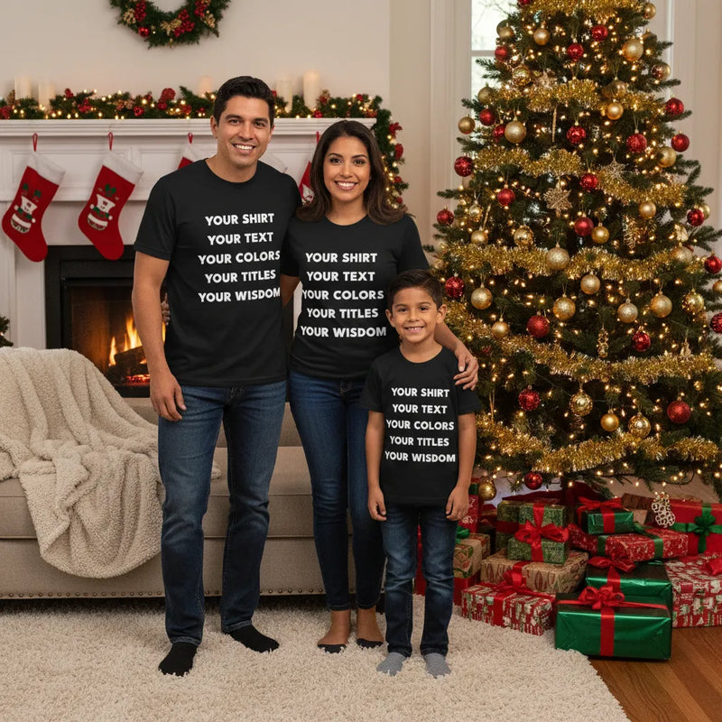Family wearing matching custom text t-shirts in front of a Christmas tree — personalized group tees on Bella Canvas 3001.